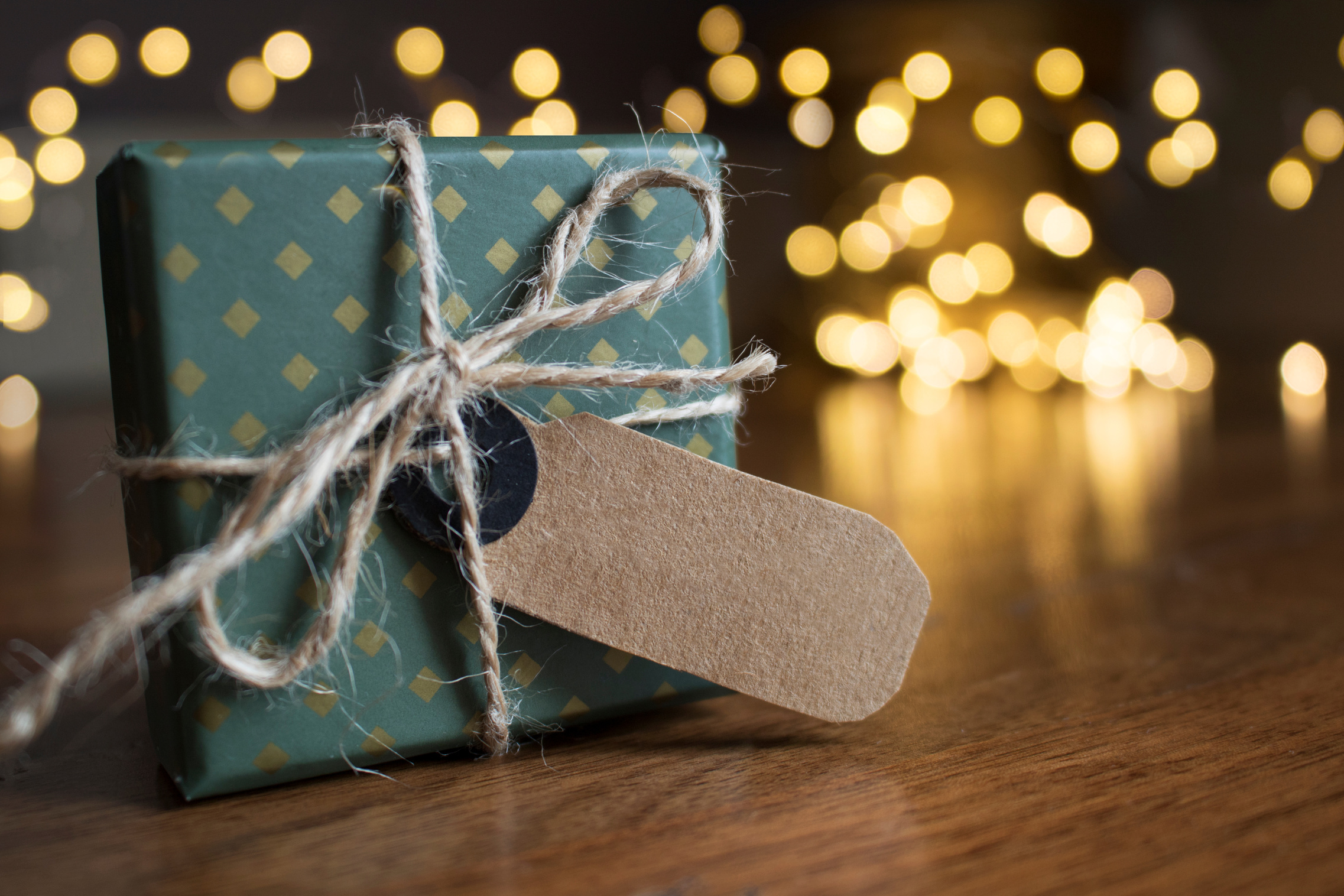 Selective Focus Photography Of Gift Box On Brown Wooden Surface